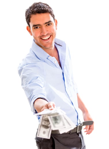 Successful business man holding money - isolated over a white background